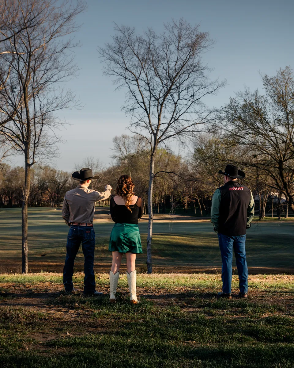 Allie Hodges and the Our OK Realty team surveying land where a new home is planned.
