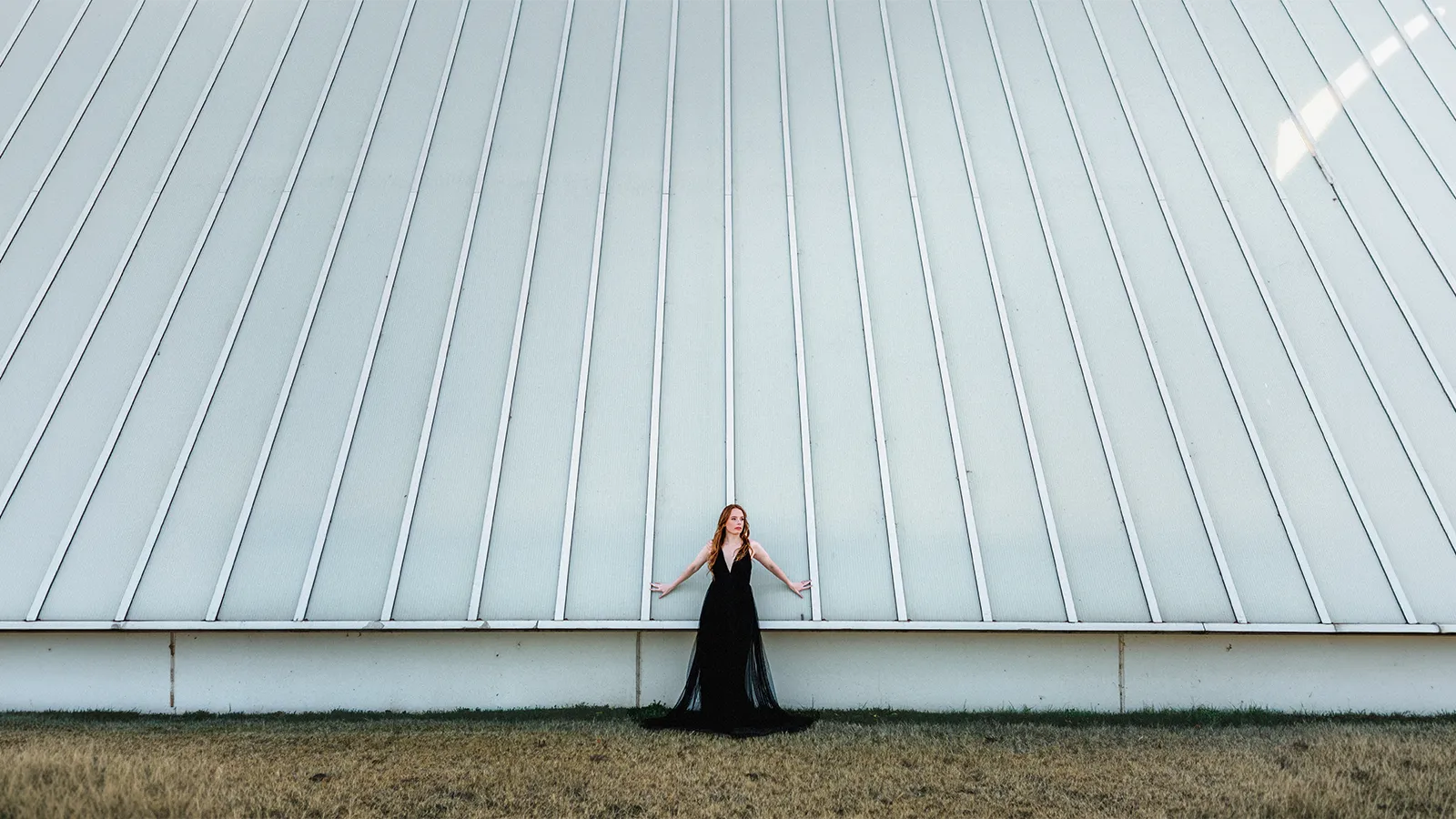 Oklahoma City fashion designer Ana wears one of her new garments outside the Boathouse District.
