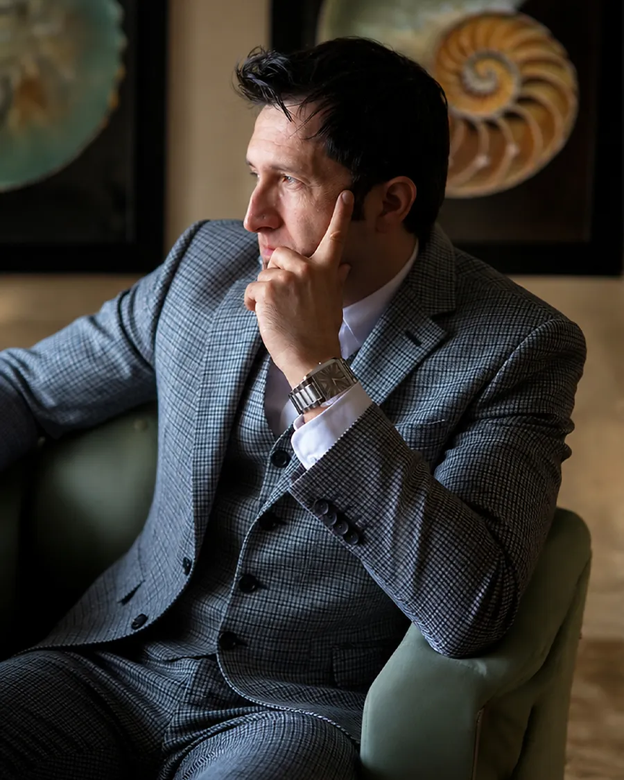 Entrepreneur Charles Rosenthal seated in a Miami Beach boutique hotel during documentary filming.
