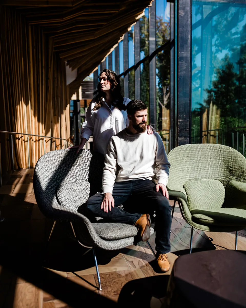 Darien and Hailey Gibson of WestSky Studio photographed together in a modern architectural interior.