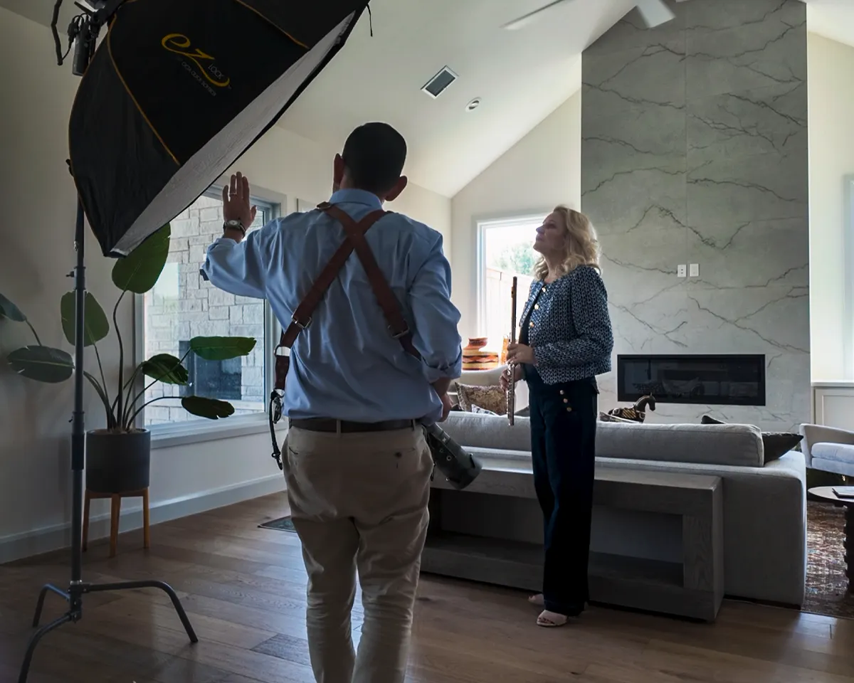 Erik Esparza directs Realtor Bonnie Gross during a Tulsa Real Producers feature shoot inside a home.
