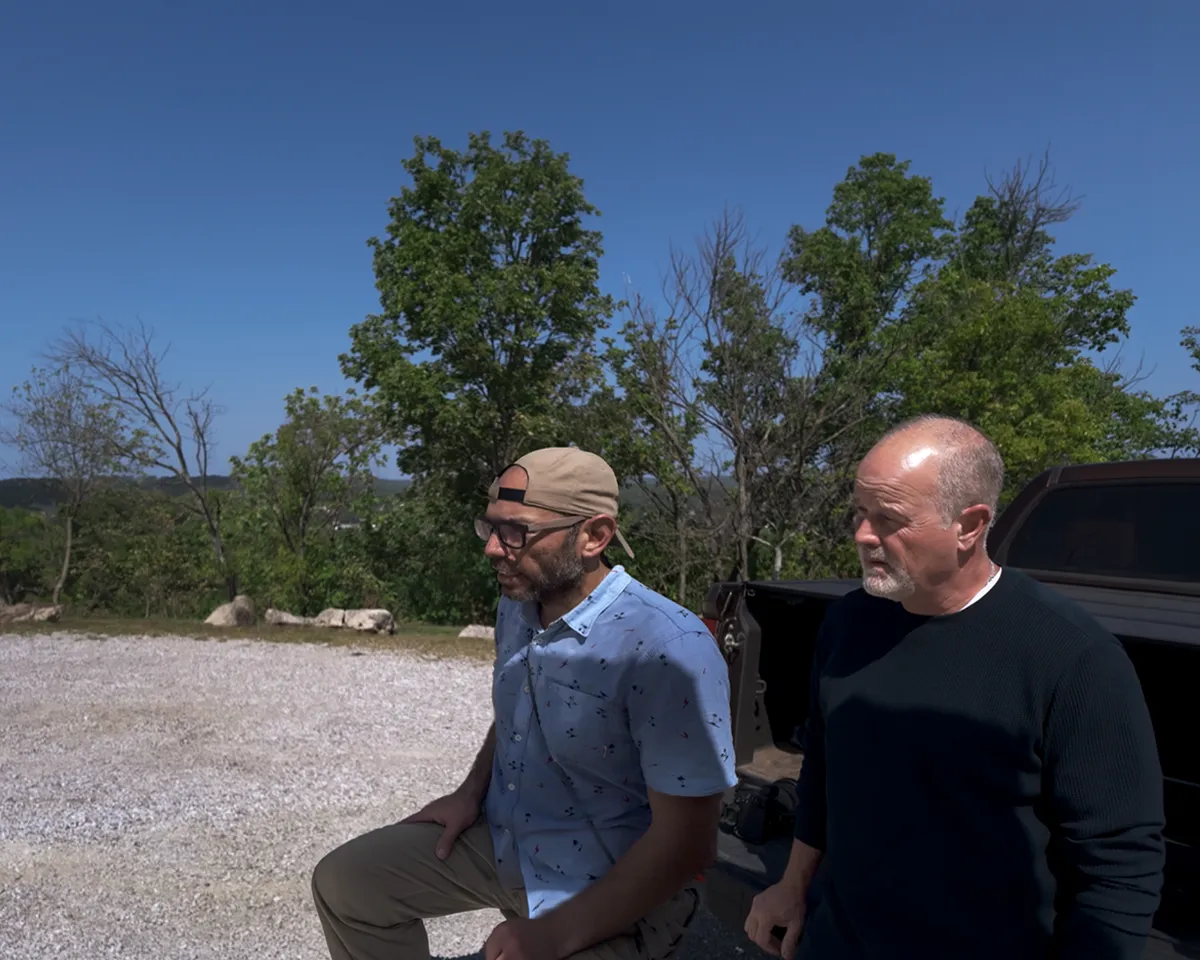 Erik Esparza talks with Realtor Patrick Huntley while planning a Tulsa Real Producers editorial shoot.