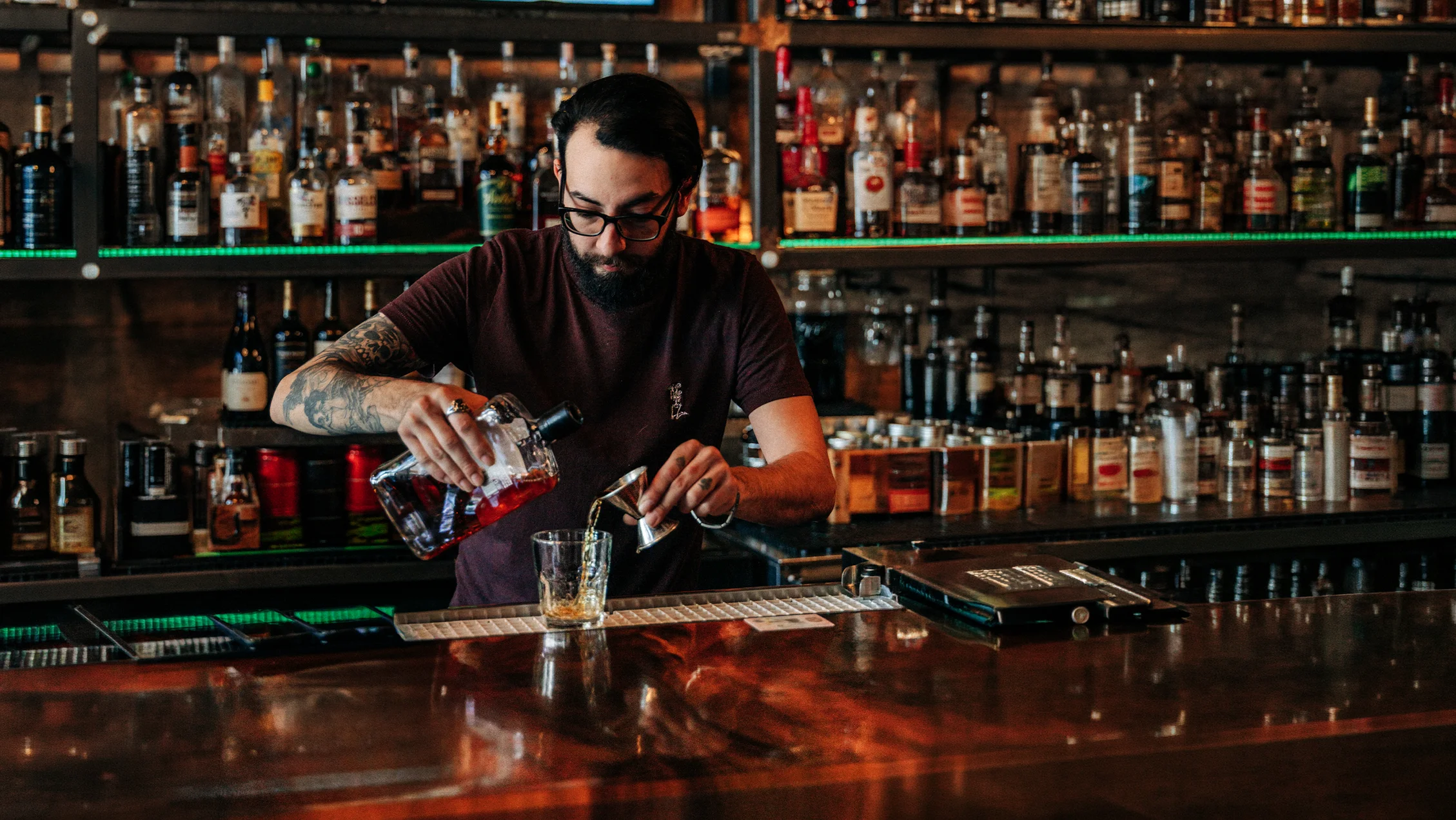 19 Thirty Three Bar Manager Joey Marquez preparing a cocktail behind the bar in San Angelo, Texas.