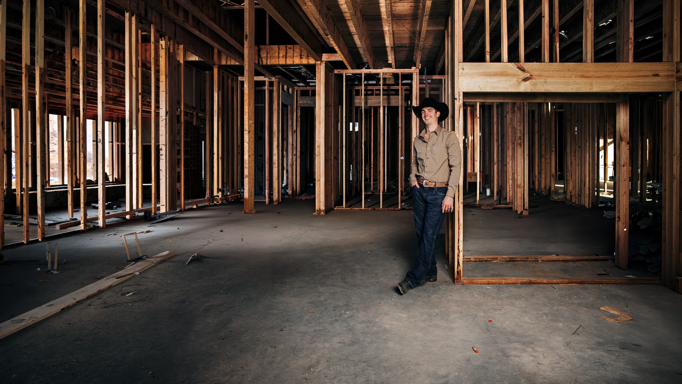 Landon of OK Realty standing inside a home under construction.