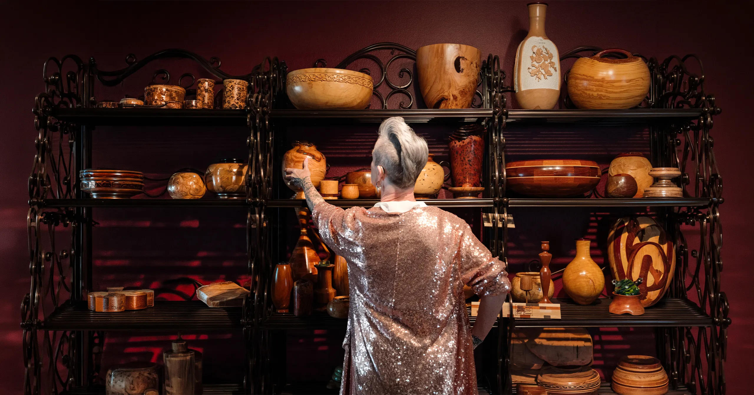 Portrait of probate real estate expert Lisa inspecting item during a Real Producers editorial feature about her work.