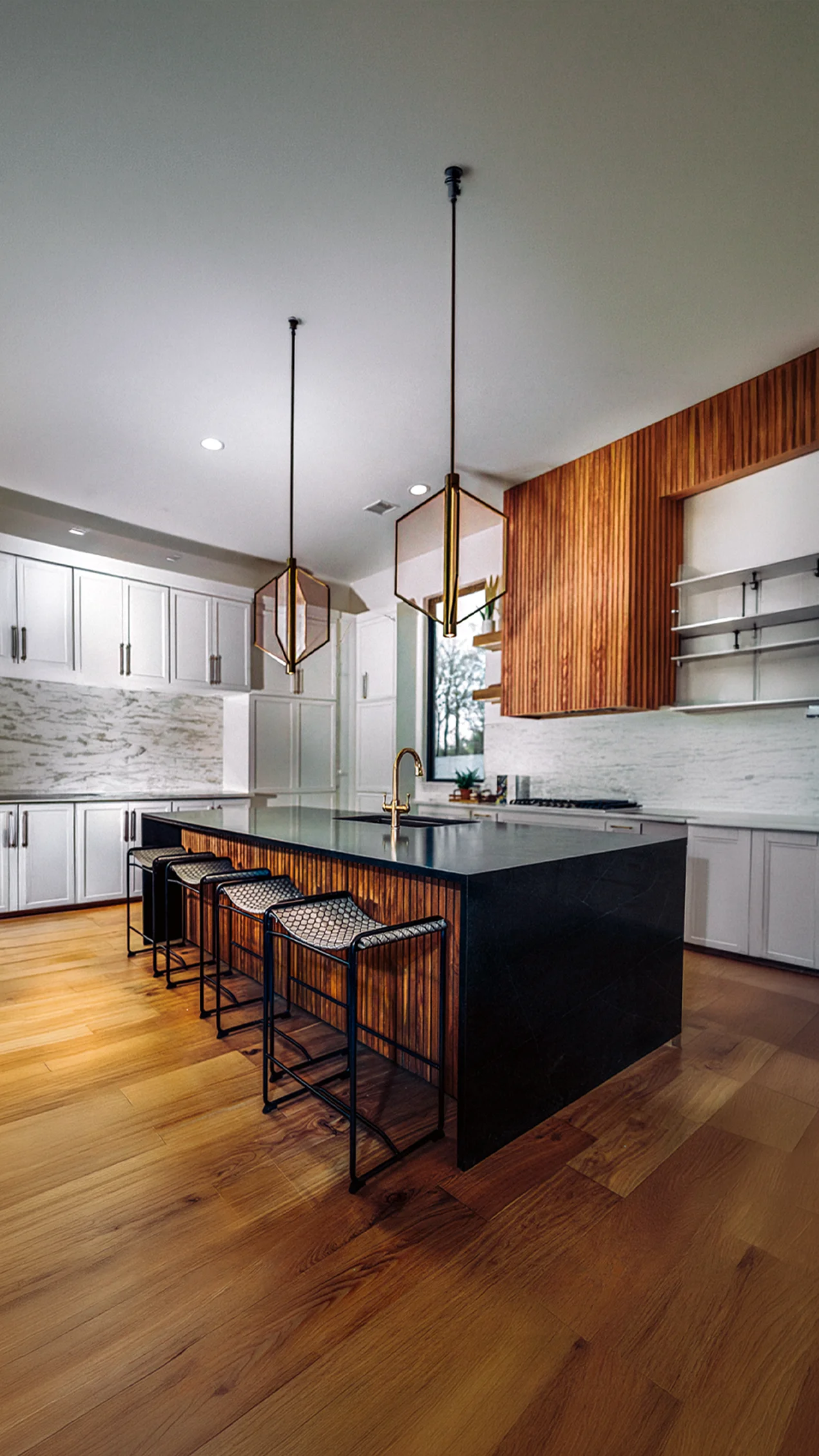 Modern kitchen inside a home listed for sale by OK Realty.