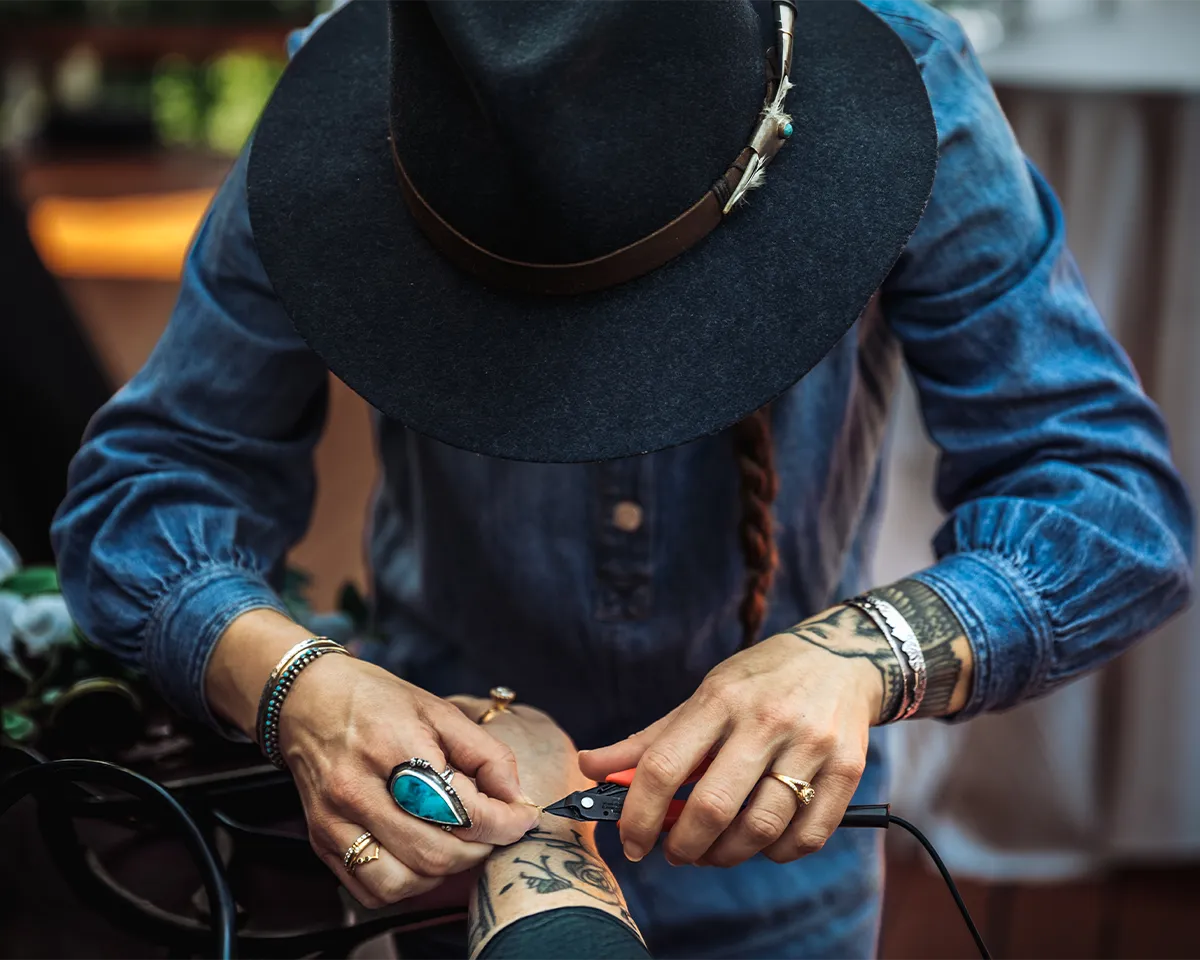 Rachel Rose of Dillon Rose shapes a custom jewelry piece by hand.
